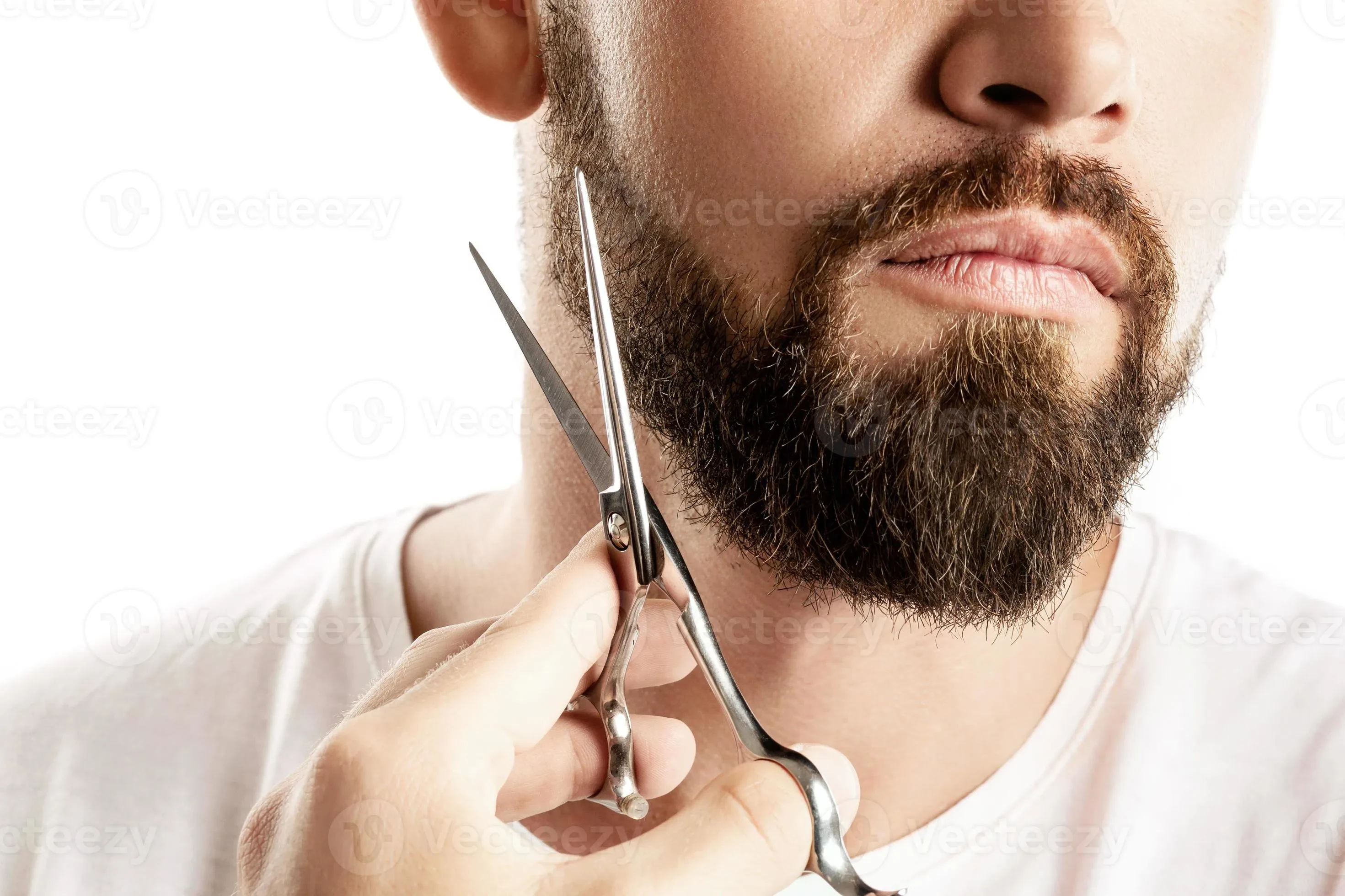 Man trimming his beard